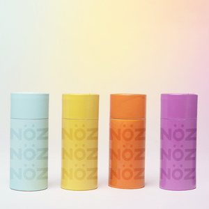 Noz Nose Sunscreen. Showing many of our available colors including but not limited to, light blue, yellow, orange, and purple.